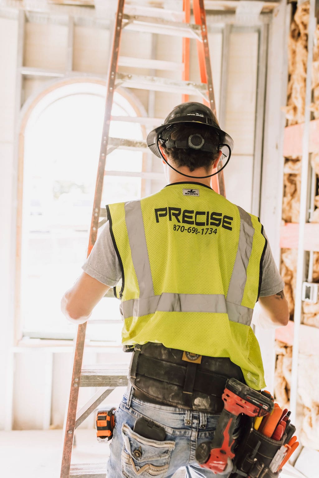 Precise contractor moving a ladder